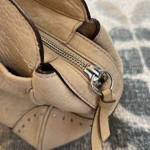 Classic Coach satchel in a soft cream color that goes with everything